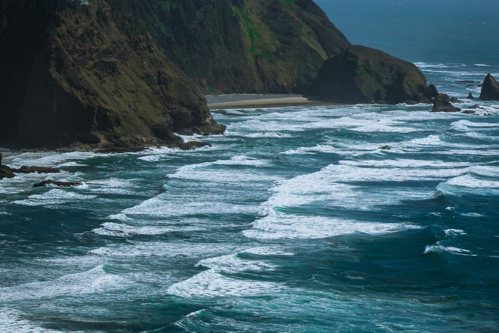 Waves breaking against the basalt shoreline at Yachats on the central Oregon coast.